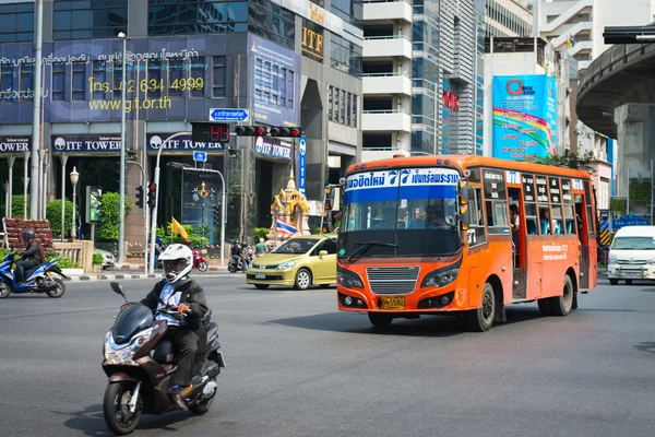 Public transport bus and motorbike on Bangkok treet