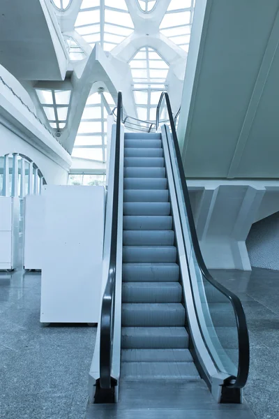 Fast moving escalator inside shopping mall