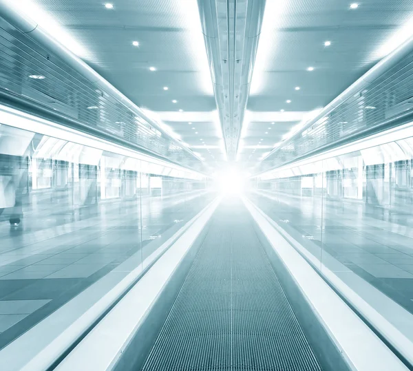 Futuristic escalator inside contemporary airport
