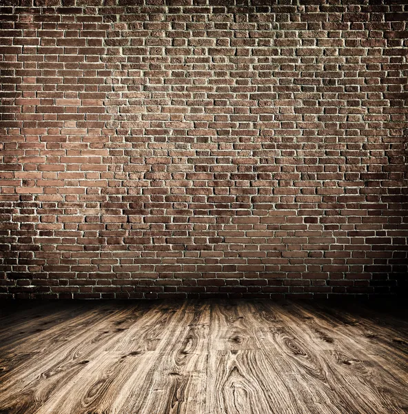 Background of aged grungy textured white brick and stone wall with light wooden floor with whiteboard inside old neglected and deserted empty interior, blank horizontal space of clean studio room