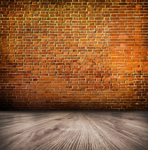 Empty black old spacious room with stone grungy wall and wooden weathered dirty floor, vintage background texture of brickwall