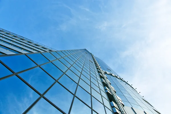 Panoramic and perspective wide angle view to steel blue background of glass high rise building skyscrapers in modern futuristic downtown at night Business concept of successful industrial architecture