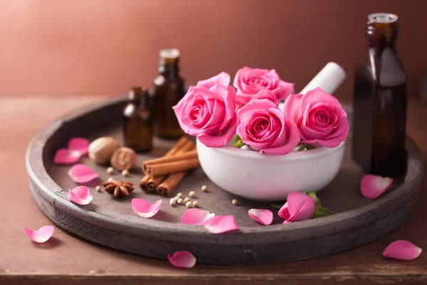 Spa and aromatherapy set with rose flowers mortar and spices