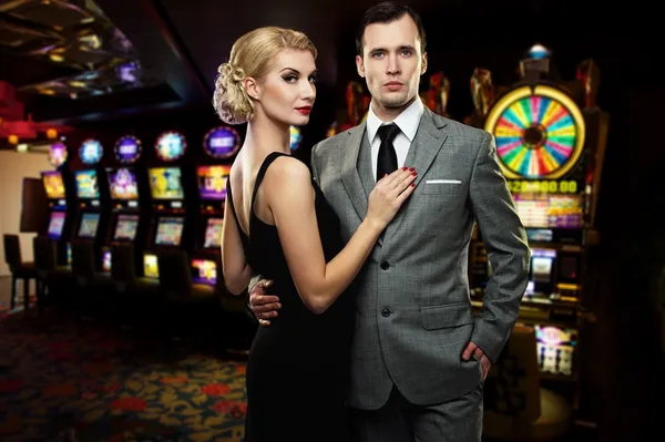 Retro couple against slot machines