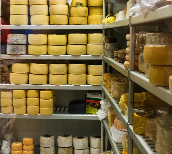 Shelves full of different cheese
