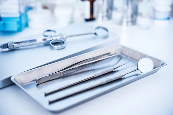 Dental tools and syringe at dentist\'s surgery
