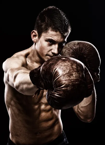 Portrait of handsome man posing on black background