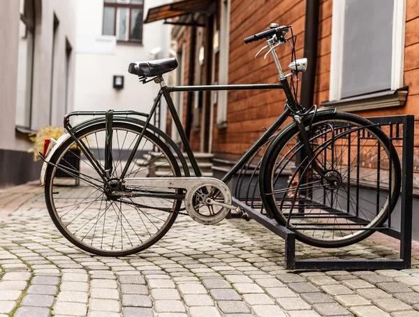 Retro bike near the house on a quiet street