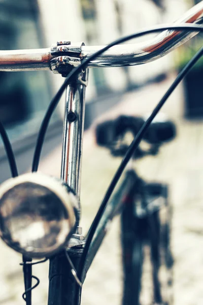 Closeup of bike handlebars and headlight