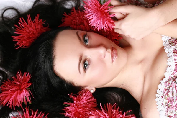 Attractive woman face with flowers
