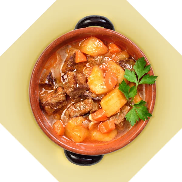 Dish of meat soup with potatoes in ceramic pot. I