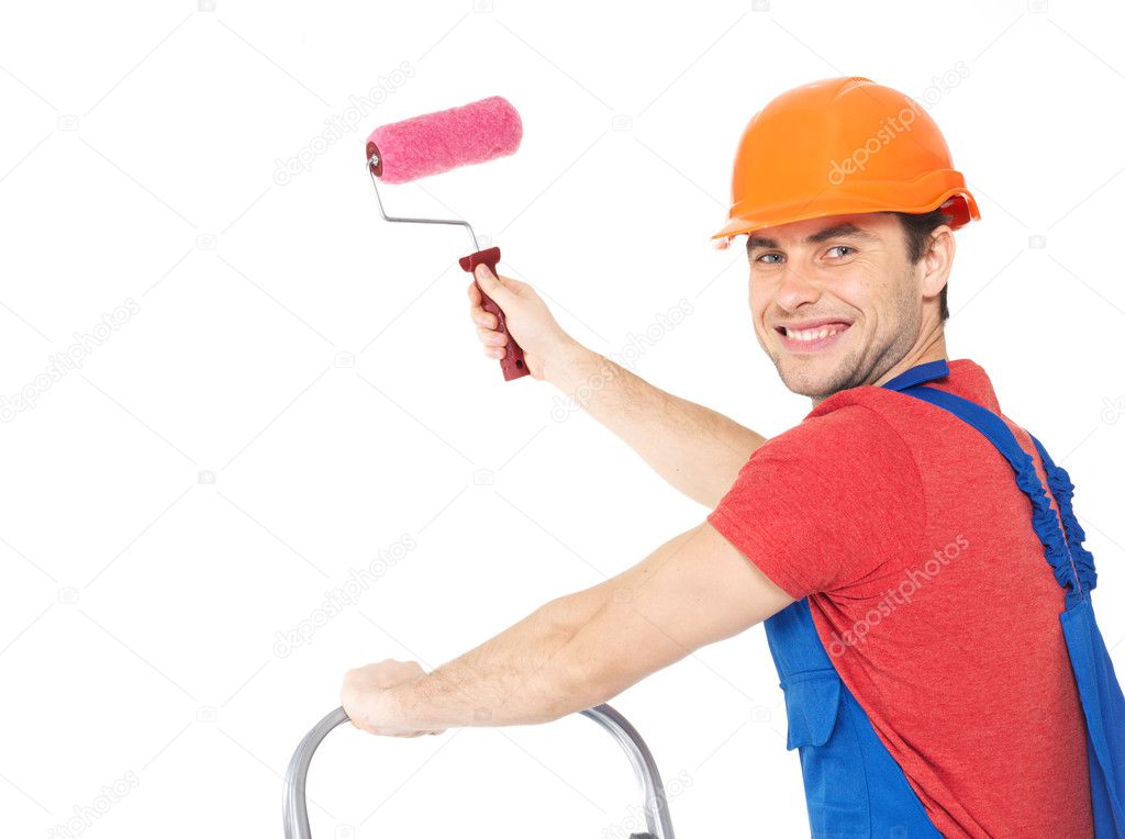 Craftsman painter stands on the stairs with roller — Stock Photo