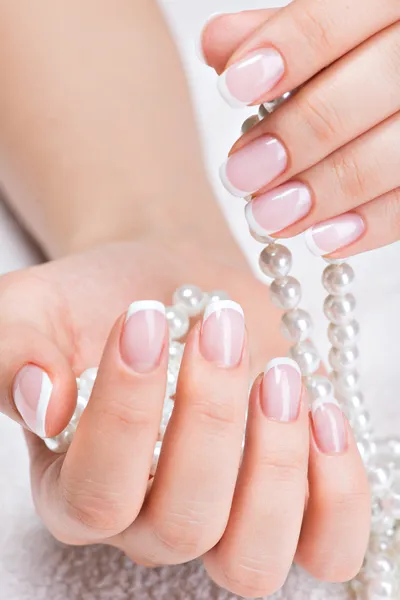 Woman's nails with french manicure