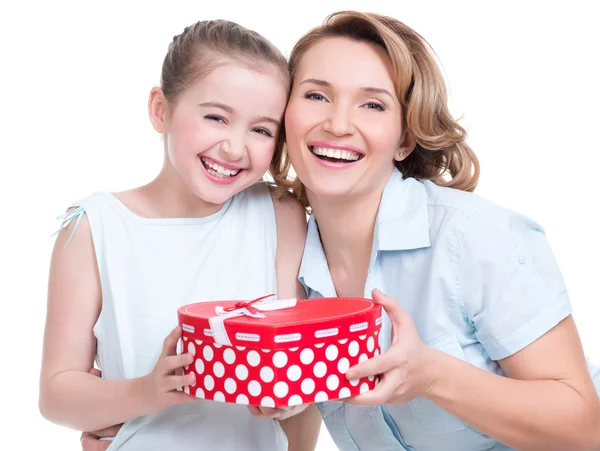 Mother and young daughter hold present