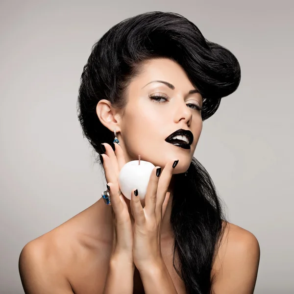 Fashion woman with modern hairstyle  with white apple