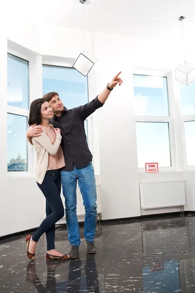 Couple in searching the real estate for a purchase