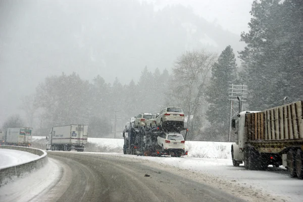 Large trucks fight a winter storm