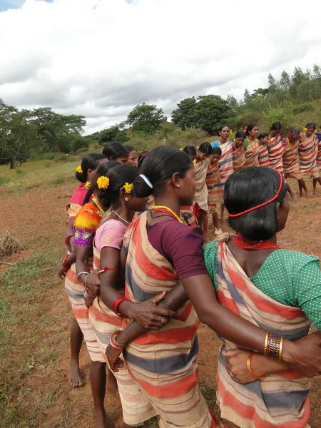 Village women link arms for Gdaba harvest dance
