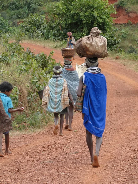 Bonda tribal women carry trade goods