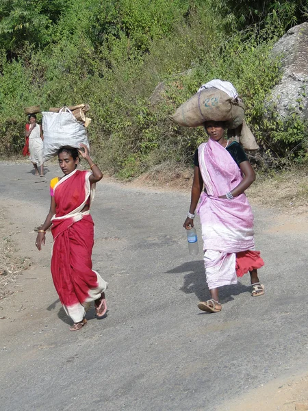 Women carry goods on their heads for weekly market