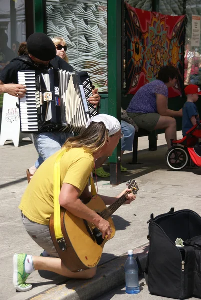 Street musicians playing accordion and guitar