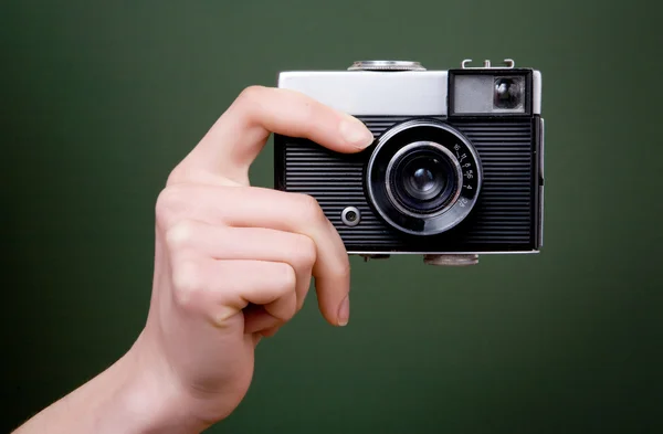 Vintage camera in hand