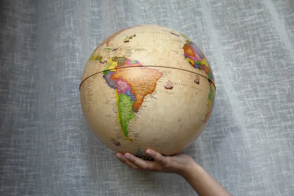 World globe in a woman hand