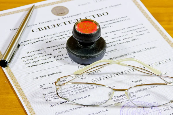 Certificate of individual businessman, glasses, pen and printing
