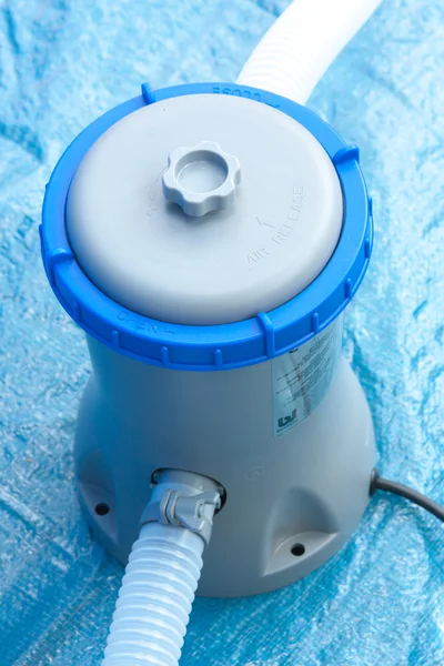 Pump with a filter for water treatment in a pool