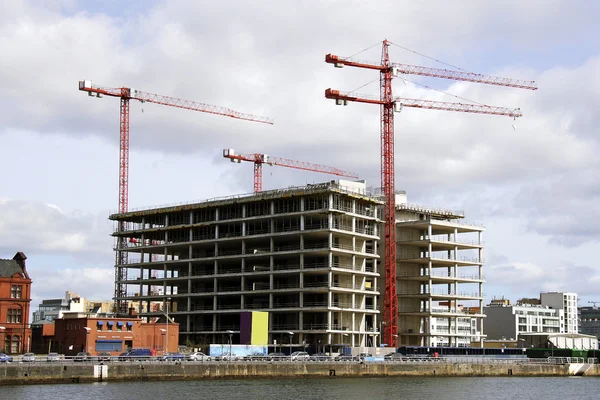 Building cranes and building house , Dublin, Ireland