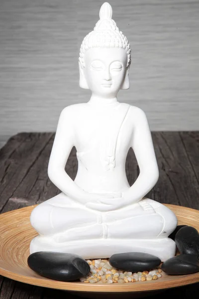 White statue of a meditating buddha