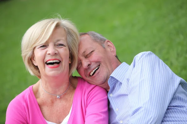 Happy elderly couple laughing together