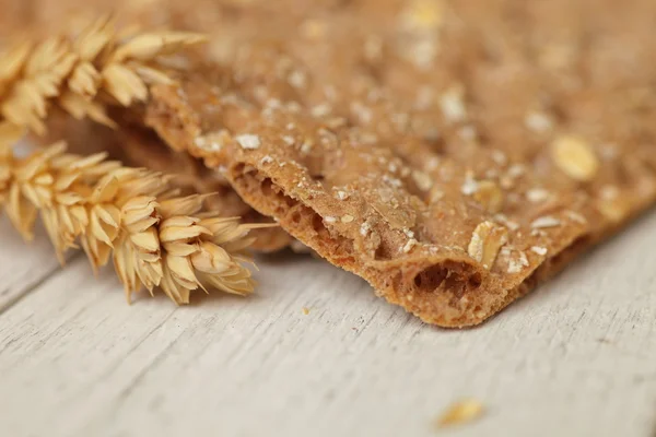 Ear of wheat with a wheat cracker or crispbread