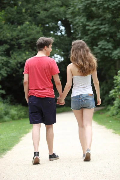 Young dating teenage couple taking a walk