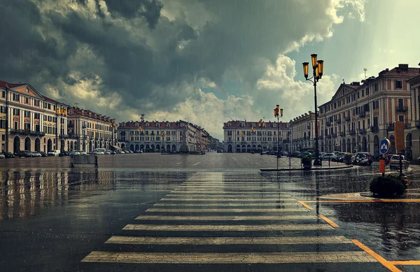 City plaza at rainy day in Cuneo, Italy.