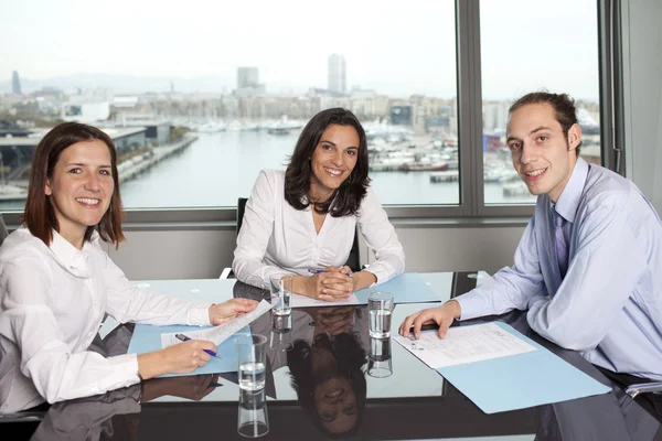 Latin businesswoman in an office with her team in an office