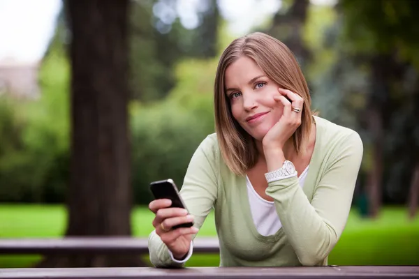 Woman holding Cell Phone