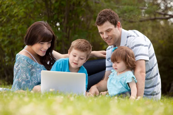 Family Outdoors with Computer