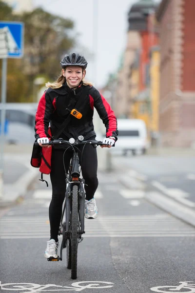 Female Cyclist With Courier Delivery Bag