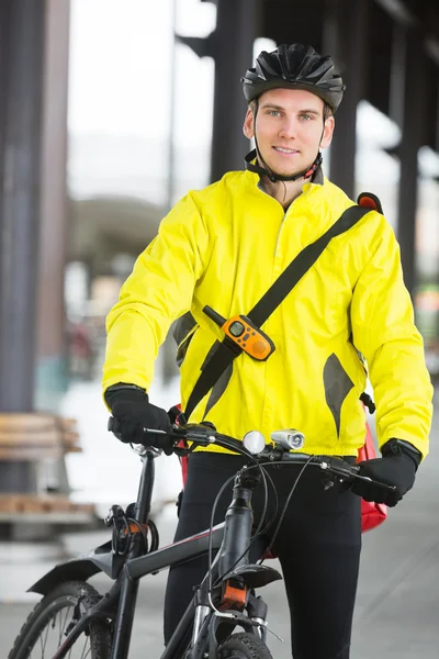 Young Man In Protective Gear With Bicycle