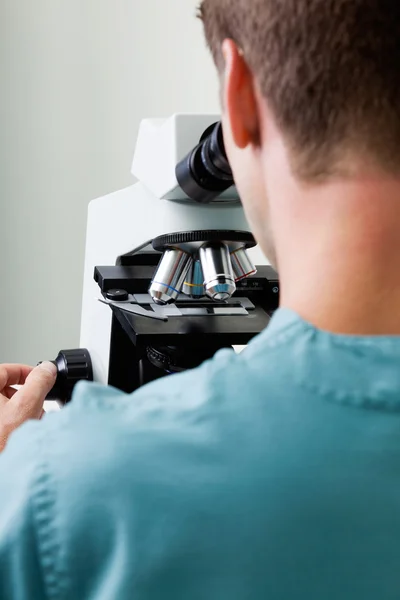 Male Researcher Using Microscope In Laboratory — Stock Photo #15858391