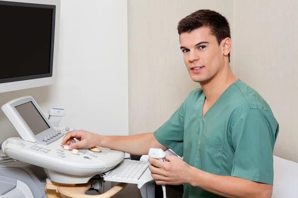 Technician Operating Ultrasound Machine