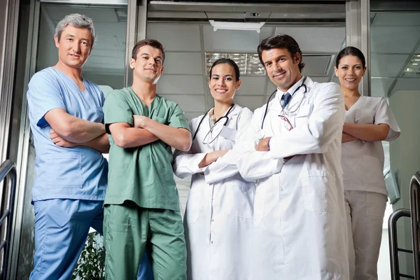 Medical Professionals Standing With Hands Folded