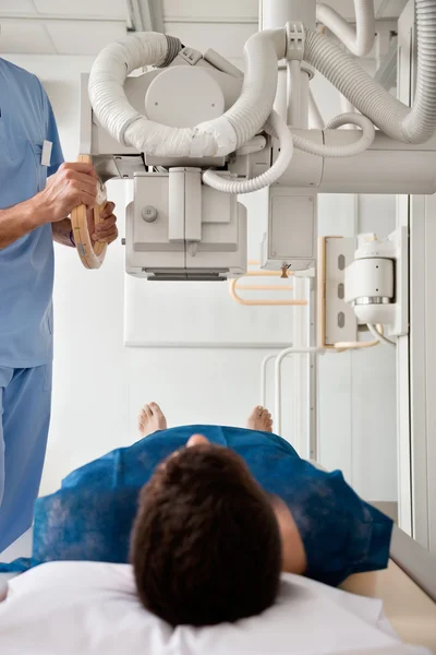 Technician Taking Patient's X-ray — Stock Photo #21417527