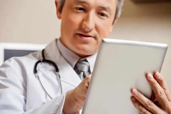 Doctor Using Digital Tablet