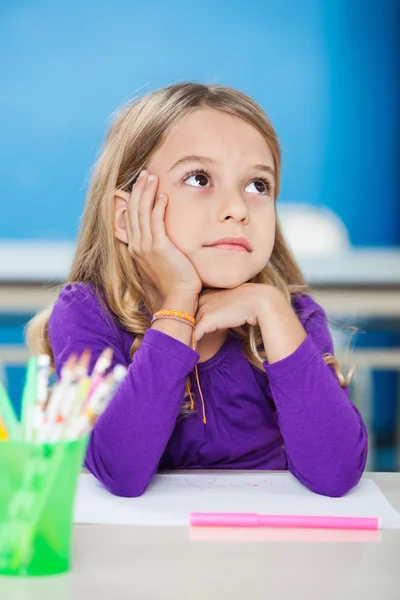 Girl With Hand On Chin Looking Away In Class