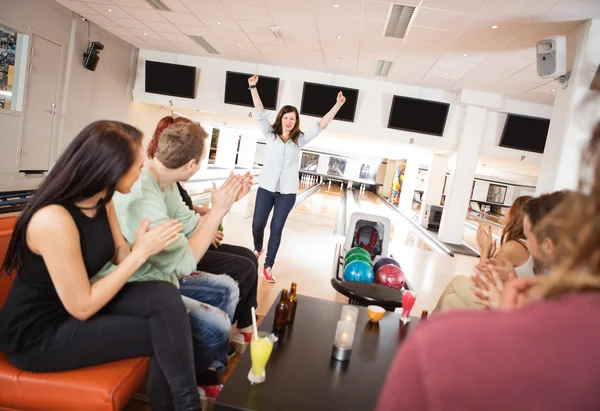 Excited Woman With Friends Applauding