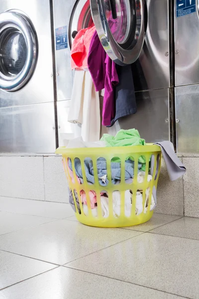 Overloaded Washing Machine And Laundry Basket