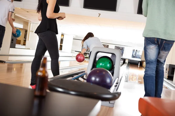 People Playing in Bowling Alley