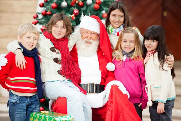 Happy Santa Claus And Children